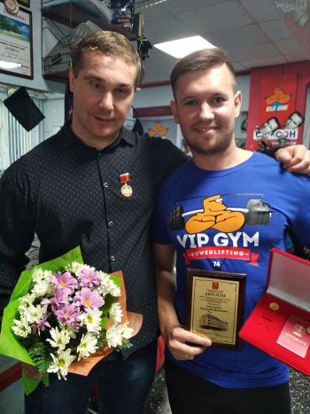 Спортсмен Дмитрий Авраменко и его тренер Николай Маслов
