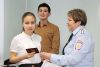 Паспорт получает Арина Шаймарданова, семиклассница школы № 3 пос. Батуринского